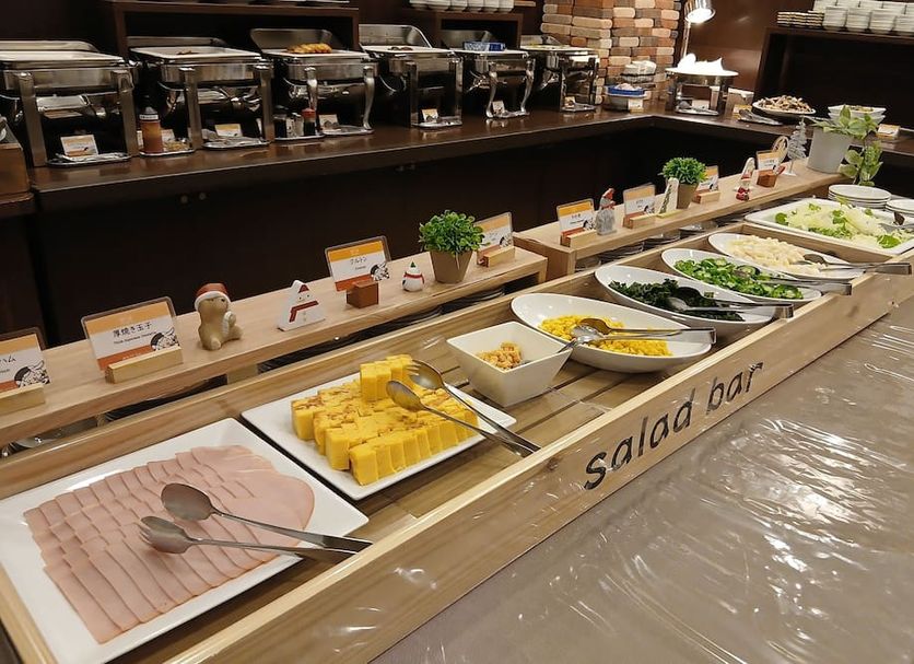 Hotel Route-Inn Saga Ekimae salad bar with sliced ham, cheese, and vegetables in Saga