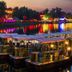 Beijing Northern Langyue Hotel Financial Street Branch in Beijing, boats on a lit riverside at dusk
