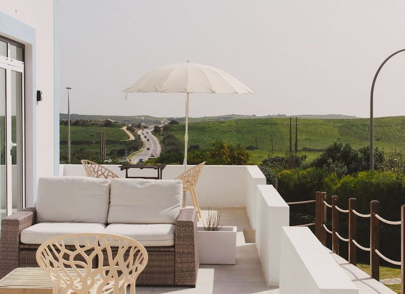 Pure Flor de Esteva in Vila do Bispo terrace with sofa, umbrella and countryside view