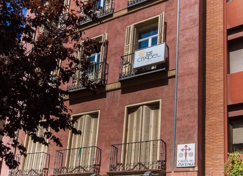BYPILLOW The Citadel hotel facade in Madrid with balconies and street trees