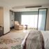 Shangmao International Hotel in Nanjing guest room with seating area and large window view