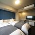 Dormy Inn Miyazaki Natural Hot Spring guest room with two twin beds and TV
