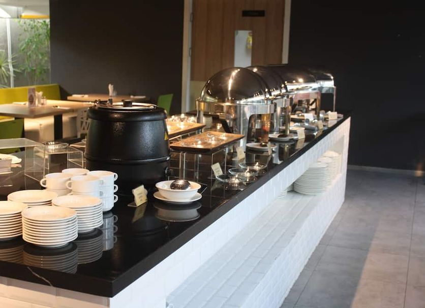 Zuri Express Jimbaran breakfast buffet with coffee urns and chafing dishes in South Kuta