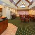Residence Inn by Marriott Oklahoma City South breakfast area with buffet, tables, and vaulted ceiling