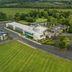 Aerial view of Moyvalley Hotel & Golf Resort in Moyvally, with golf course, grounds and surrounding countryside