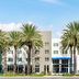 Wyndham Anaheim Hotel in Anaheim with palm trees in front of a modern hotel exterior