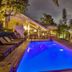 Felissimo Exclusive Hotel in Balneário Camboriú with illuminated rooftop pool and lounge seating