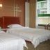 Binhai Mingzhu Hotel Beijing room with two twin beds and a window in Beijing