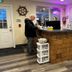 Inn at the Sea in Long Beach front desk area with reception counter and guest checking in