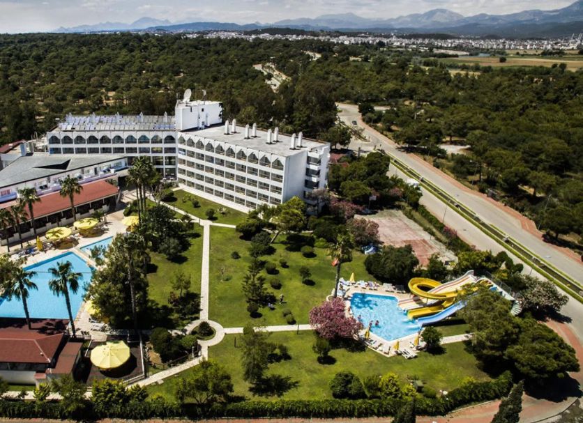 Serra Park in Side with aerial view of pool, water slide, and lush gardens