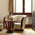 Residenza Delle Arti Rome seating area with two chairs, small table, window, and wood floor