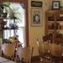 Historic Smith Hotel B&B dining room in Glendale with wooden tables, chairs, and decorative cabinets