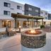 Courtyard by Marriott Johnson City outdoor patio with fire pit, seating area and hotel façade