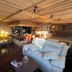 Le Cairn, Les Deux-Alpes: cozy wood-paneled lounge with sofas, armchairs and a bar