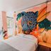 Supertramp Hostel Machupicchu room with bold jaguar mural and single bed in Machu Picchu