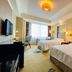 Ramada Plaza by Wyndham Tian Lu Hotel Wuhan guest room with two beds and city-view window in Wuhan