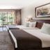 Jolie Ville Hotel & Spa Kings Island Luxor guest room with twin beds and garden-view patio doors