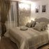 Priska Heritage Rooms Split: elegant guest room with king bed, stone accent wall, and bedside lamps