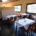 Pousada Atalaia in Campos do Jordão dining room with breakfast tables and buffet spread