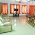 Achayans Homestay Mararikulam in Alappuzha: spacious lounge with sofas, TV, and curtained windows