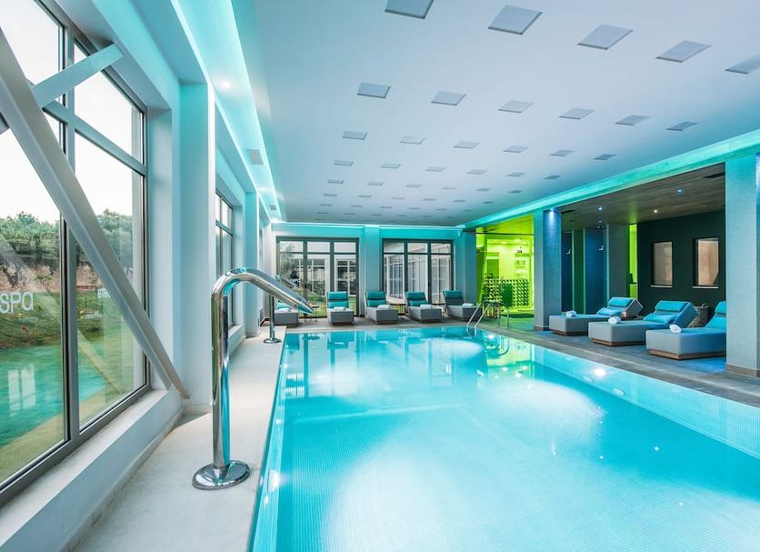 Stella Village Seaside Hotel indoor pool with loungers in Hersonissos