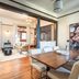 Naramata Inn in Naramata dining area with table, chairs and adjoining sitting room