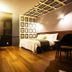 Karak Tourist Hotel in Seoul room with bed, wood floors, desk, wall art and ceiling light