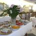 Hotel 4 Stagioni Sensus Spa buffet table with fruit, pastries and flowers in Bardolino