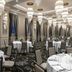 The Warrior Hotel, Autograph Collection in Sioux City ballroom with chandeliers, round banquet tables and tall windows