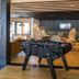 Novotel Narbonne Sud game lounge with foosball table and seating area in Narbonne
