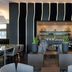 AC Hotels by Marriott Tallahassee Universities at the Capitol lounge with sleek bar and dining tables