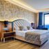 Grand Uysal Apart Hotel Alanya guest room with king bed, balcony and sea view