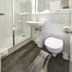 ibis Haguenau Strasbourg Nord bathroom with shower, toilet and wall mirror in Haguenau