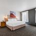 Spark by Hilton Amarillo Medical Center guest room with king bed, desk, and large windows in Amarillo