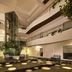 In Fashion Hotel & Spa in Playa del Carmen atrium with glass elevator and indoor pool or water feature