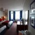 West Rocks Townhouse Eastbourne twin guest room with bay window seating and TV