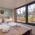 Center Parcs De Vossemeren room in Lommel with twin beds, large forest-view windows and modern decor