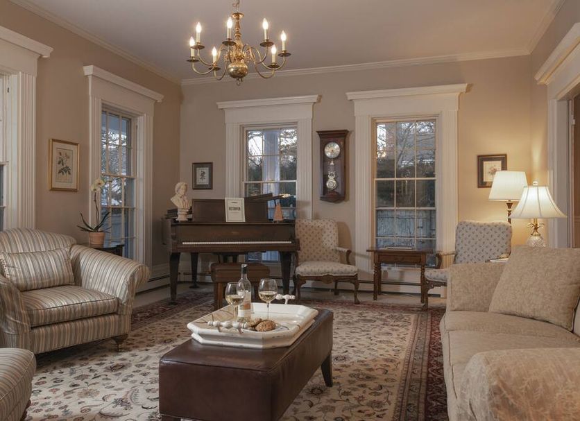 Liberty Hill Inn in Yarmouth lounge with piano, chandelier, sofas and armchairs