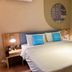 Home Inn Neo Wuxi Xihu East Road Dongting guest room with double bed and bedside lamps