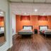 Motel 6 Elizabeth NJ Newark Liberty Intl Airport room with two beds and orange accent wall