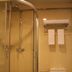 Beijing Northern Langyue Hotel Financial Street Branch bathroom with glass shower and toilet in Beijing