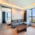 Ventimo Hotel & Residence Jeju in Jeju City with sofa, coffee table, and large windows overlooking the city