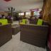 Balis Best Bar and Resort Nairobi lounge with wicker seating and bar area