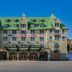 Fairmont Le Manoir Richelieu in La Malbaie, grand stone hotel with green roof and main entrance