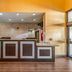 Quality Inn West Plano - Dallas lobby front desk with tile floor and stone accent wall in Plano