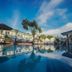 Hotel Paraiso Kora in San Blas with a serene pool reflecting the sky and palm trees