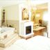 Landhotel Christopherhof in Grafenwiesen: spa room with mosaic whirlpool tub, fireplace and chandelier