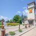 Super 8 by Wyndham Houghton Lake exterior with tower entrance and landscaped grounds