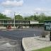Cassville Budget Inn in Cassville exterior with parking lot and roadside sign