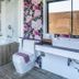 Chiang Mai Thai House bathroom with floral wallpaper, bathtub, toilet, and window view in Chiang Mai